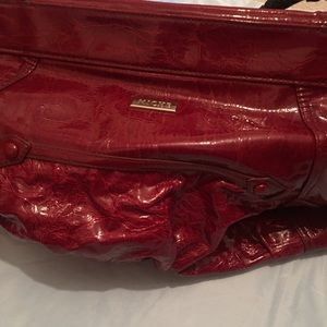 Miche deep red bag with black handles.